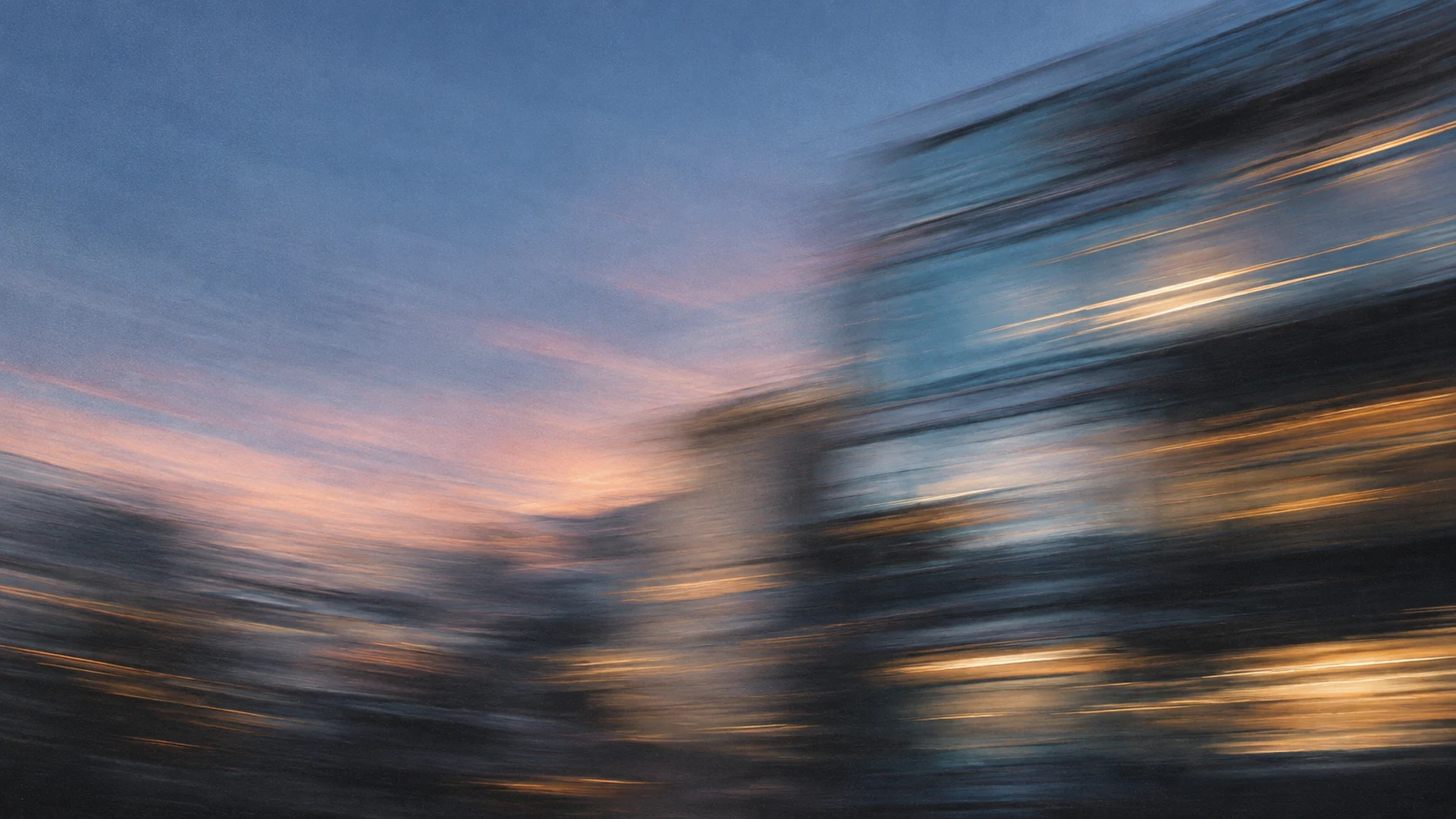 Blue-hour light passing across sculptural city architecture